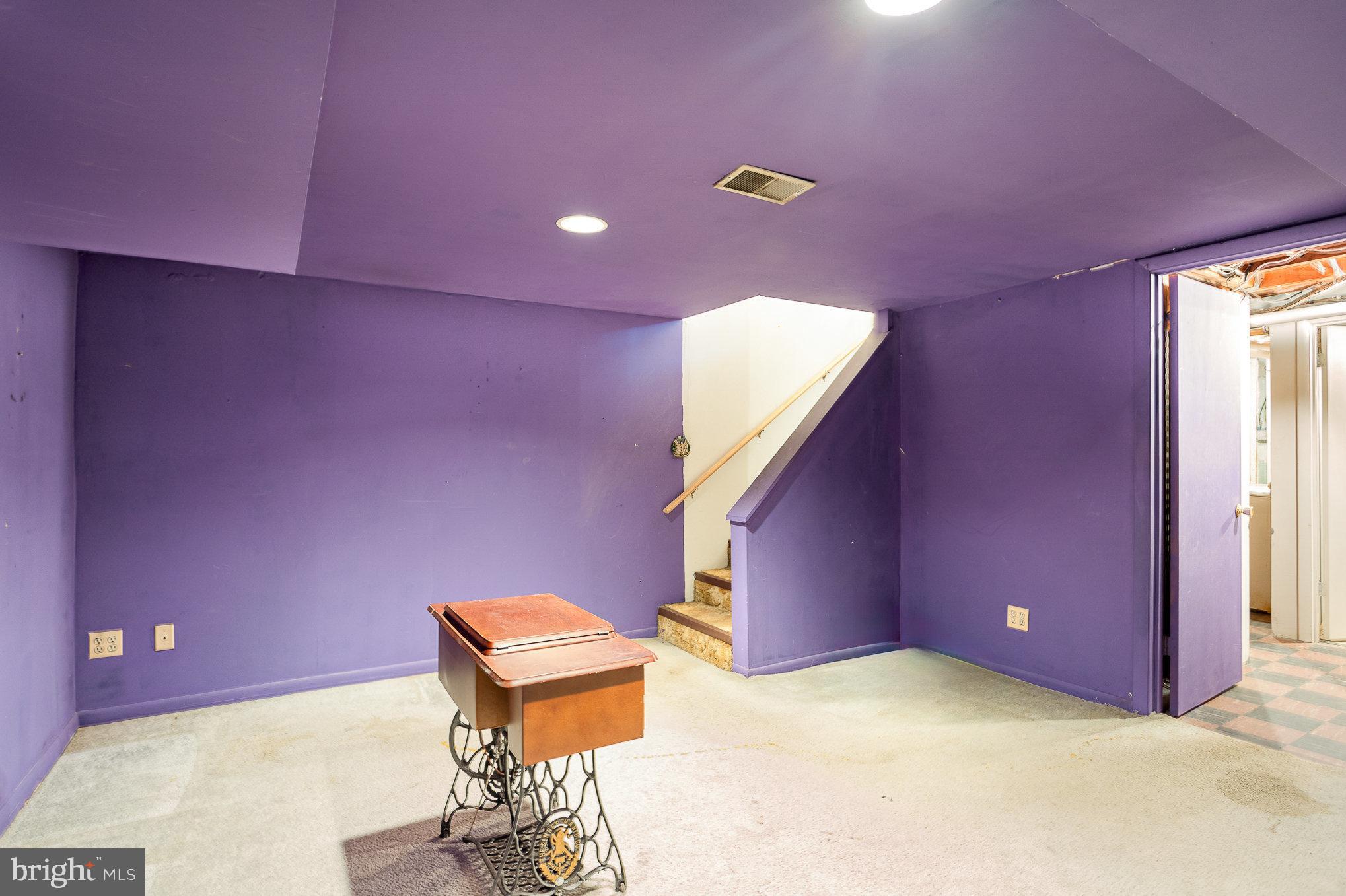1408 Locust Street Curtis Bay, MD 21226 - Photo 18 of 25 a view of a hall with a projector