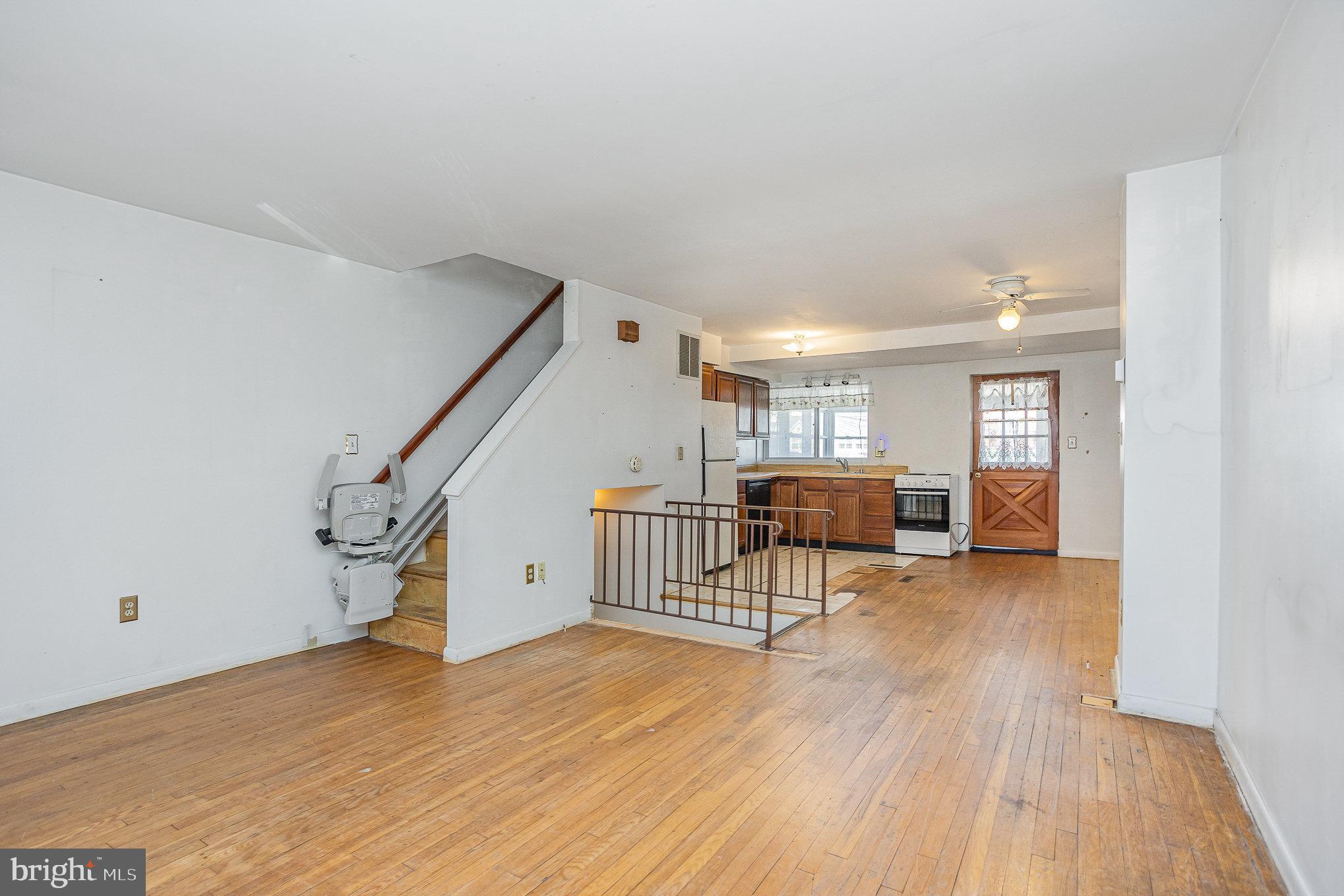 1408 Locust Street Curtis Bay, MD 21226 - Photo 3 of 25 a view of main area with wooden floor and furniture