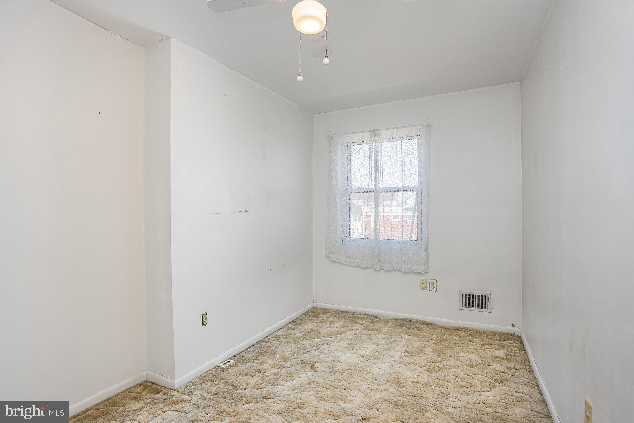 1408 Locust Street Curtis Bay, MD 21226 - Photo 10 of 25 an empty room with a window