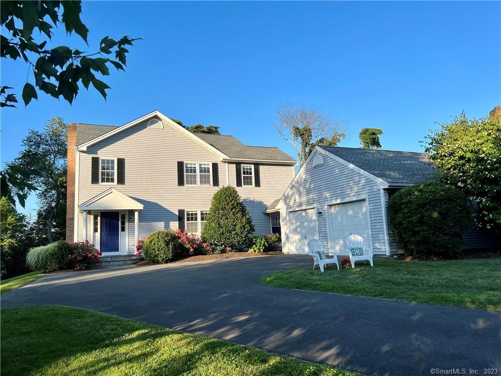 20 Grassy Hill Road Monroe, CT 06468 - Photo 1 of 1 a front view of a house with a garden