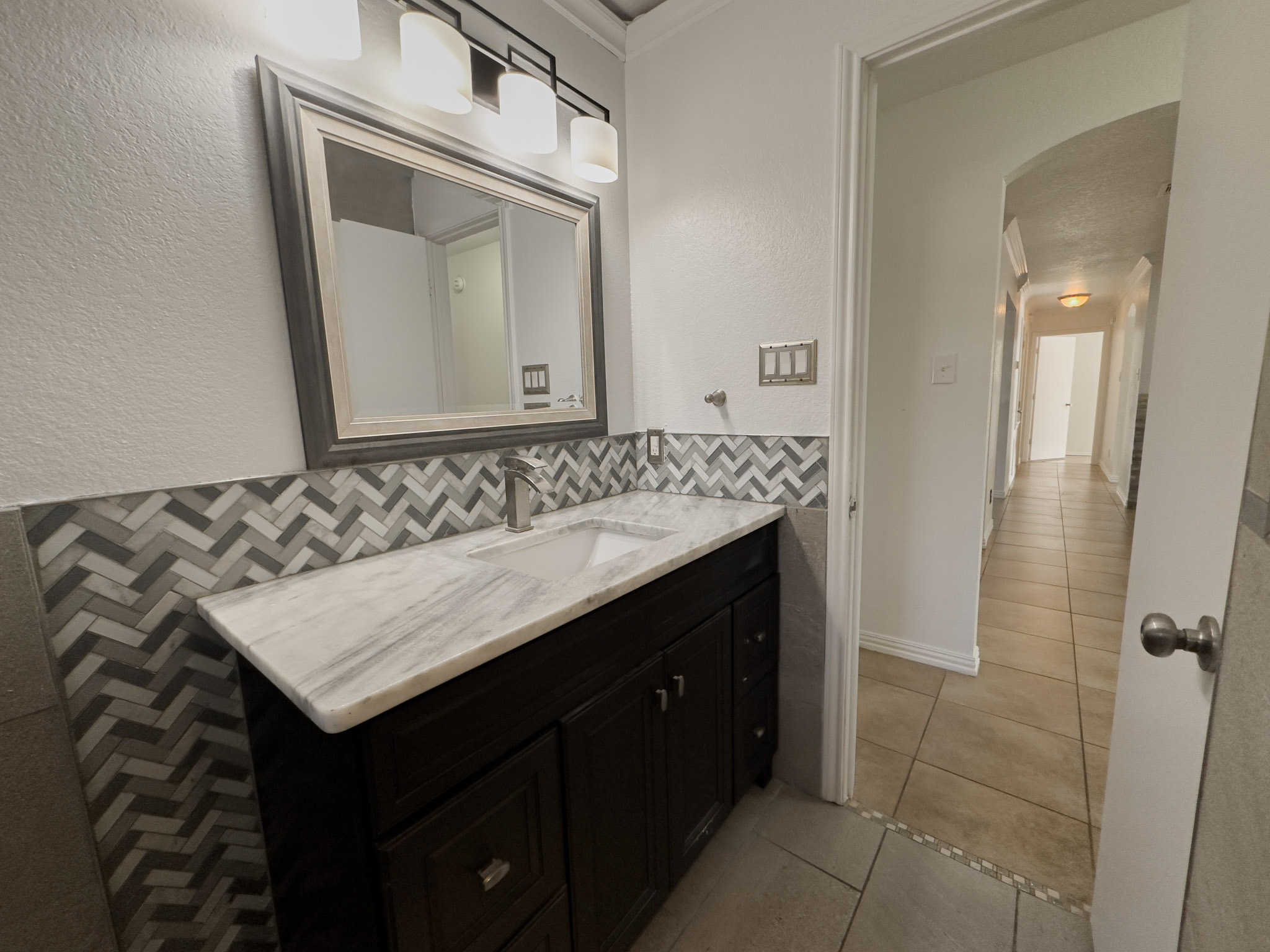 3806 Fieldcrest Drive Killeen, TX 76549 - Photo 14 of 33 a bathroom with a sink vanity and a mirror
