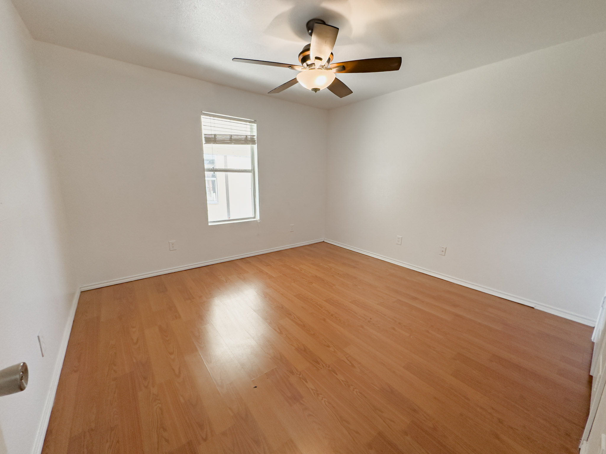 3806 Fieldcrest Drive Killeen, TX 76549 - Photo 15 of 33 an empty room with a window and a ceiling fan