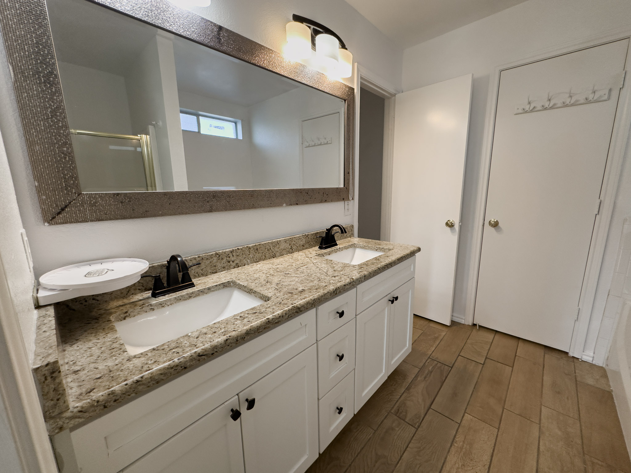 3806 Fieldcrest Drive Killeen, TX 76549 - Photo 20 of 33 a bathroom with a granite countertop double vanity sink and mirror