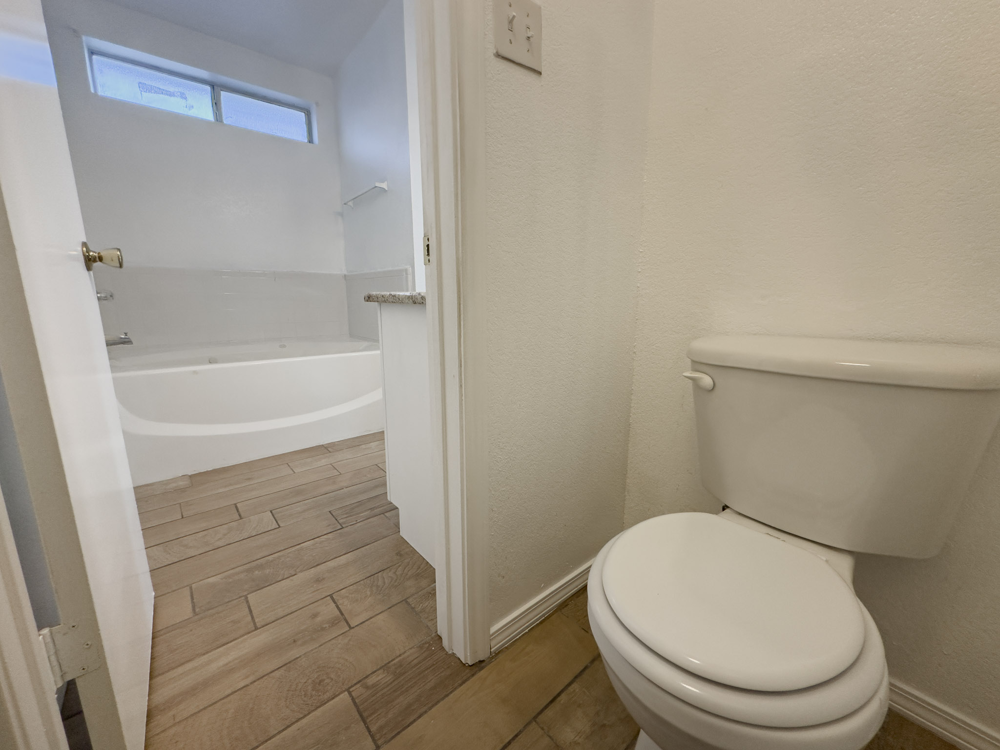3806 Fieldcrest Drive Killeen, TX 76549 - Photo 22 of 33 a white toilet sitting next to a bath tub