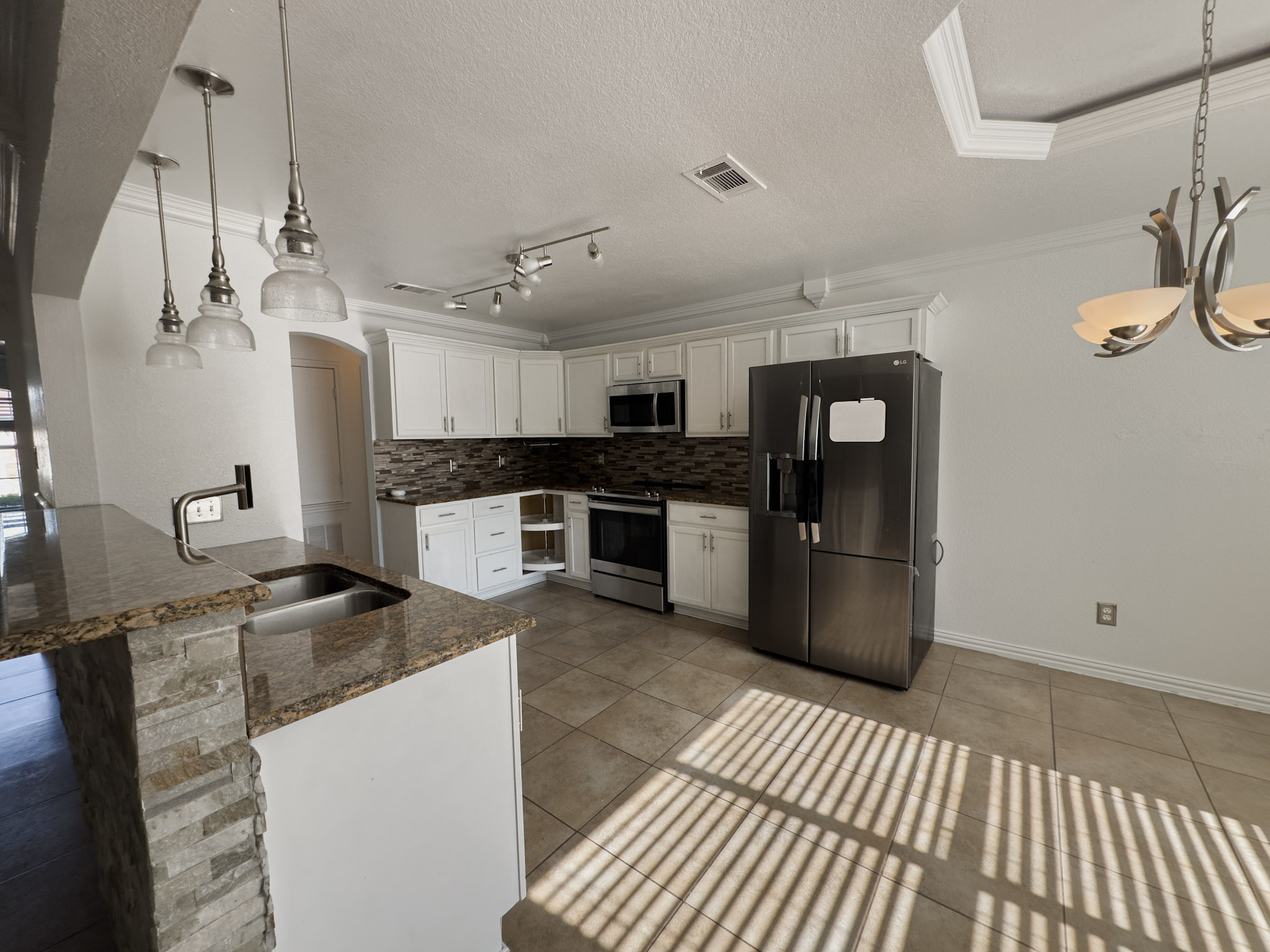 3806 Fieldcrest Drive Killeen, TX 76549 - Photo 3 of 33 a kitchen with stainless steel appliances granite countertop a stove a sink and a refrigerator