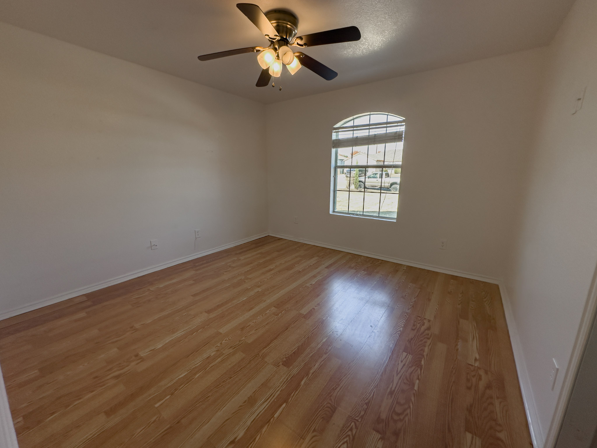 3806 Fieldcrest Drive Killeen, TX 76549 - Photo 10 of 33 wooden floor in an empty room with a window