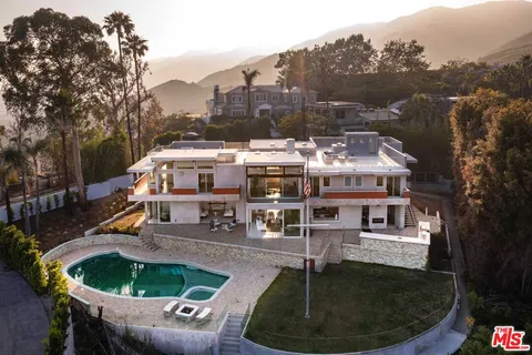 a balcony with table and chairs