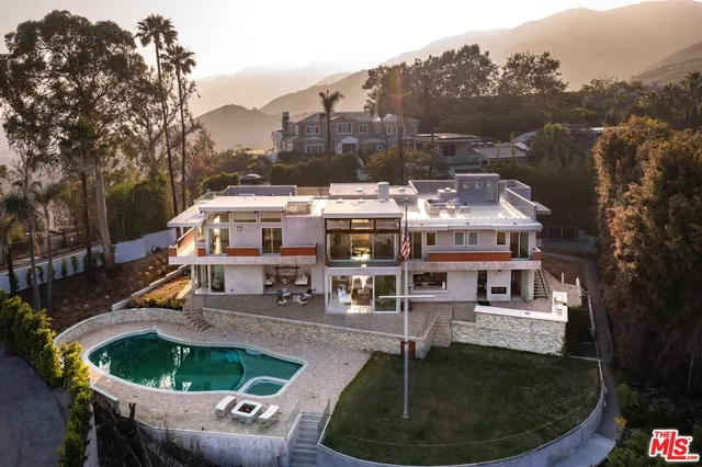 a balcony with table and chairs