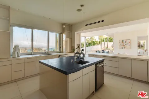 a kitchen with sink and window