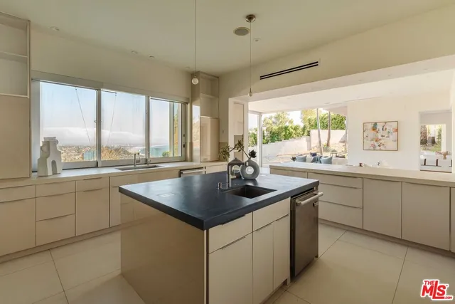a kitchen with sink and window