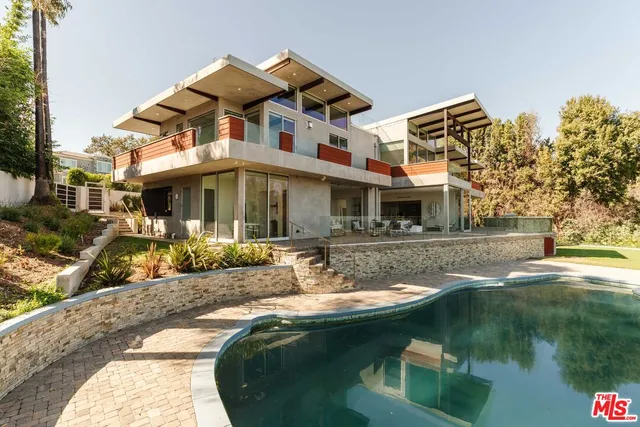 a front view of a house with swimming pool