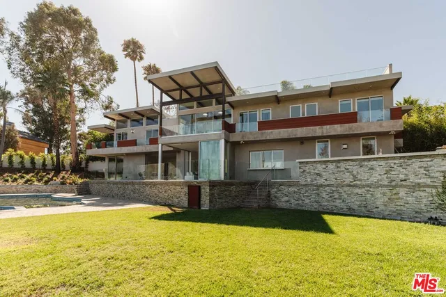 a front view of a house with swimming pool