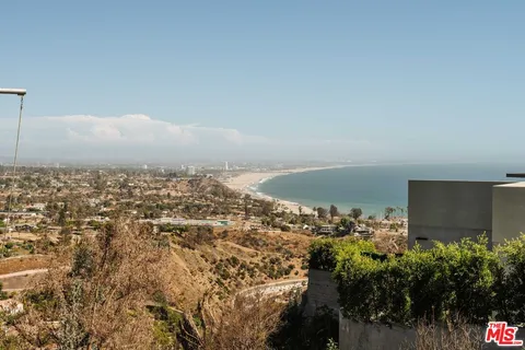 a bathroom with a double vanity sink a mirror and a bathtub