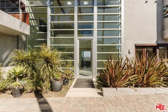 a view of potted plants in front of door