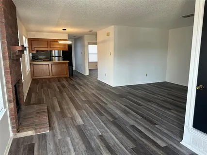 a view of a kitchen from the hallway
