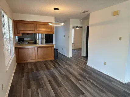 a kitchen with a sink and refrigerator