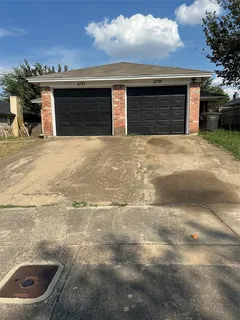 a front view of a house with a garage