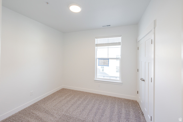 4662 Poplar Way, Unit Q303 Mapleton, UT 84664 - Photo 14 of 18 Unfurnished room with baseboards and light carpet