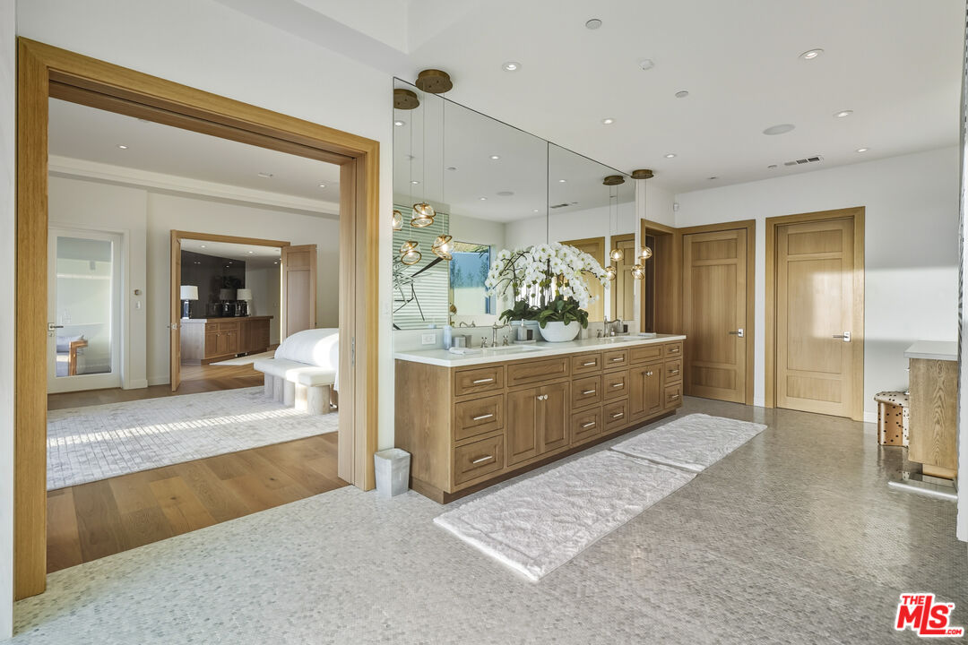 3140 Sweetwater Mesa Road Malibu, CA 90265 - Photo 38 of 71 a view of a bathroom with sink and mirror