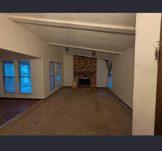 a view of empty room with windows