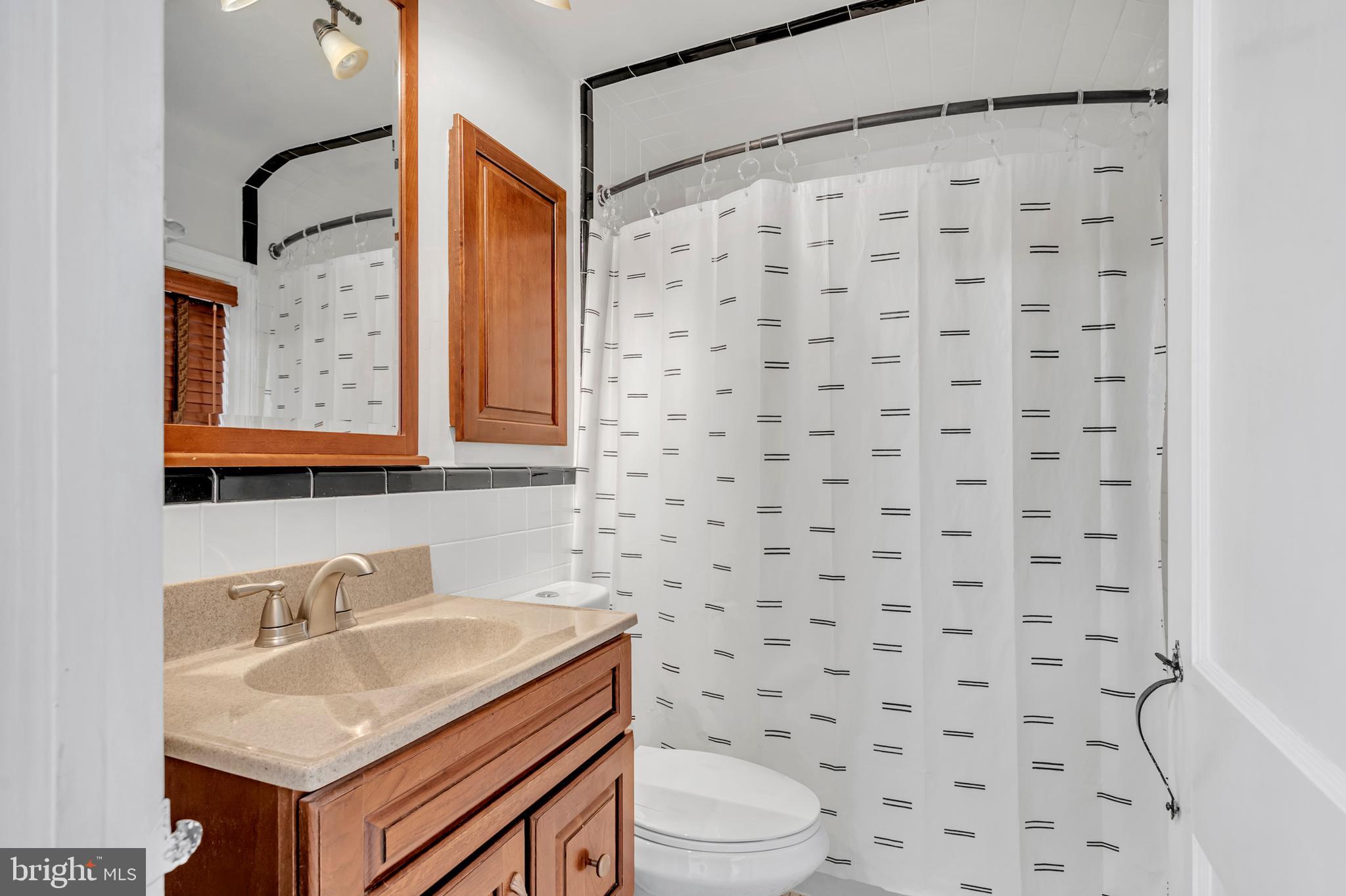 29 School Lane Springfield, PA 19064 - Photo 16 of 29 a bathroom with a sink toilet and shower