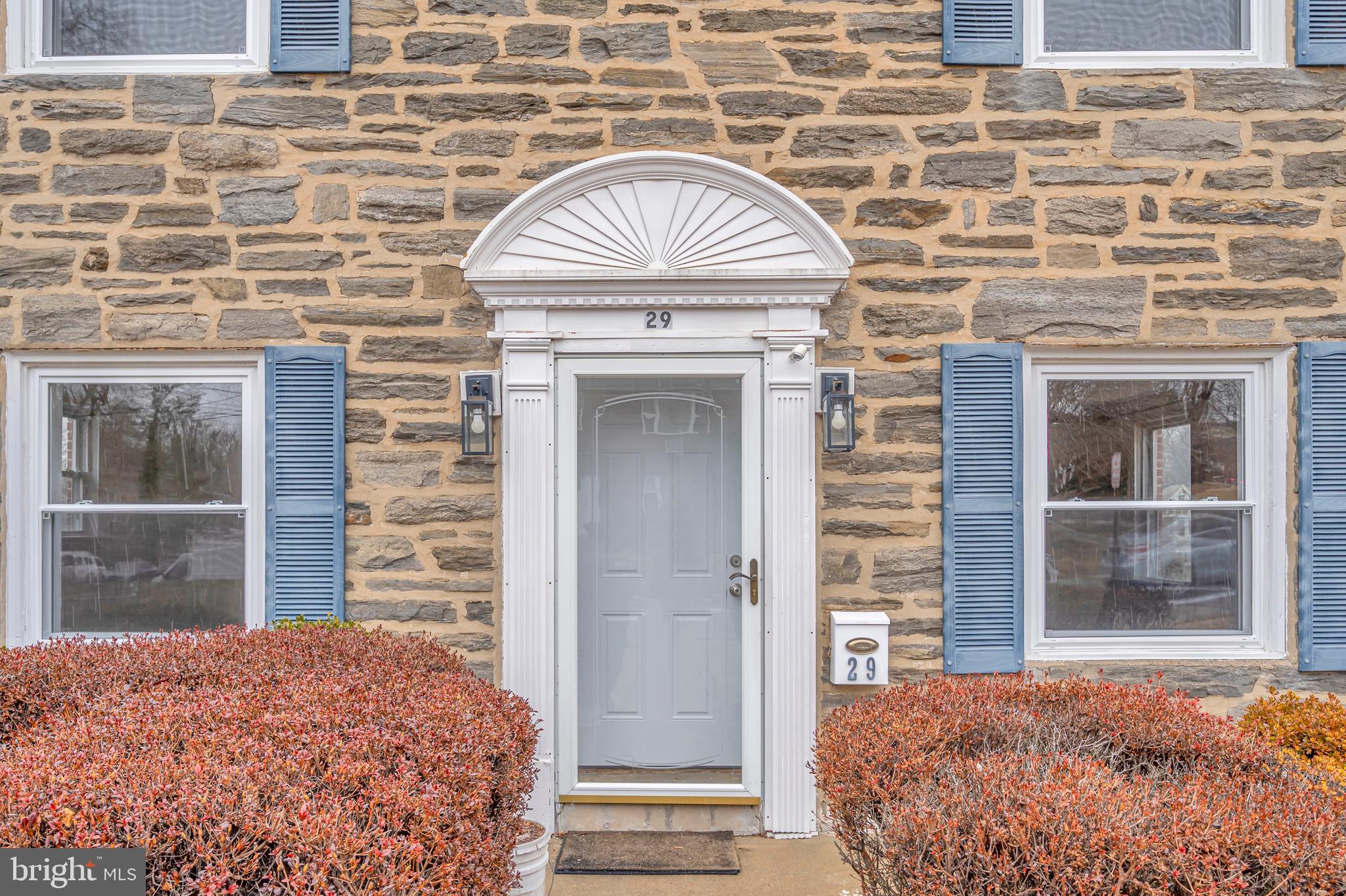 29 School Lane Springfield, PA 19064 - Photo 2 of 29 a front view of a house with a garden