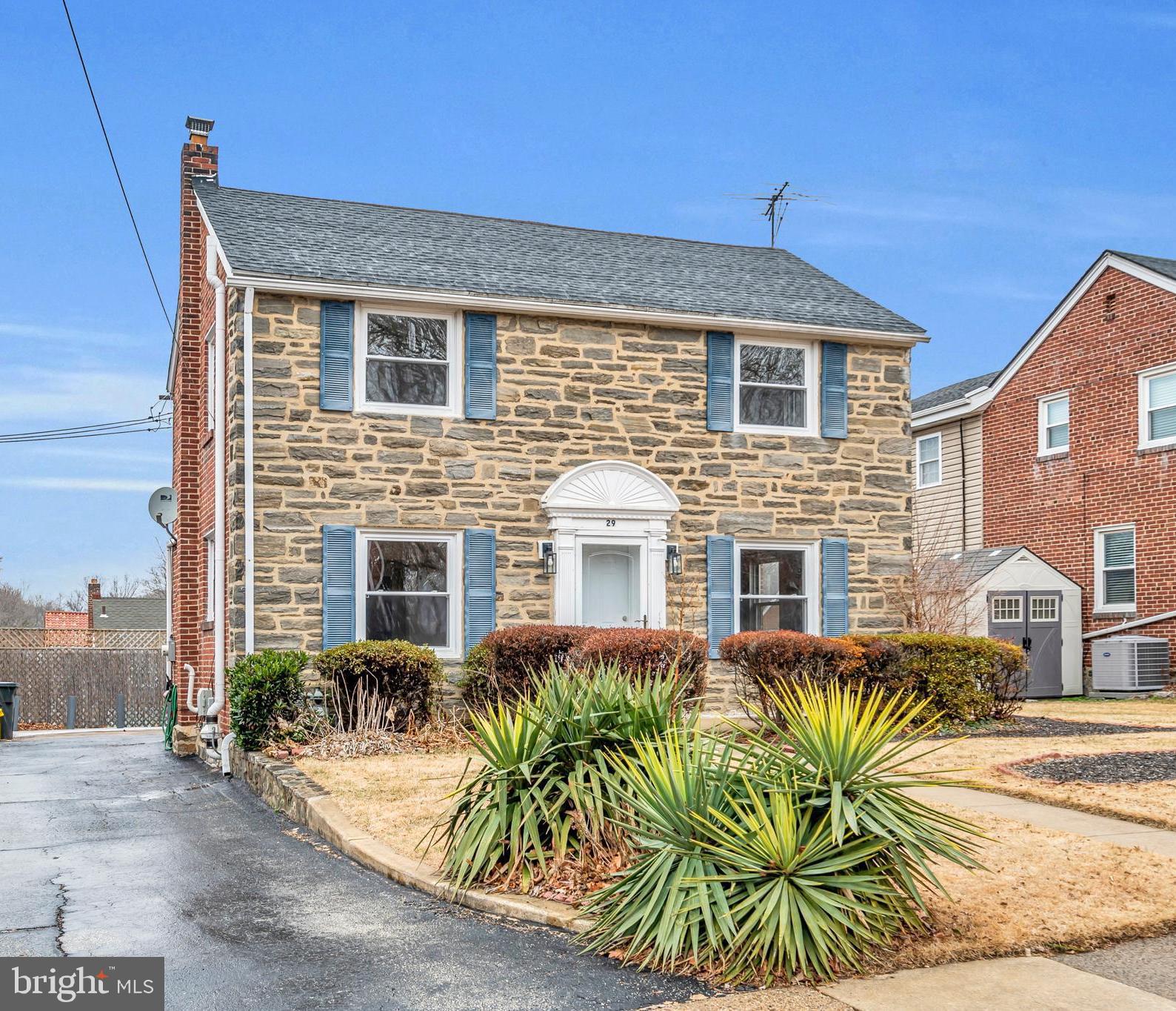 29 School Lane Springfield, PA 19064 - Photo 25 of 29 a front view of house with yard outdoor seating and barbeque oven