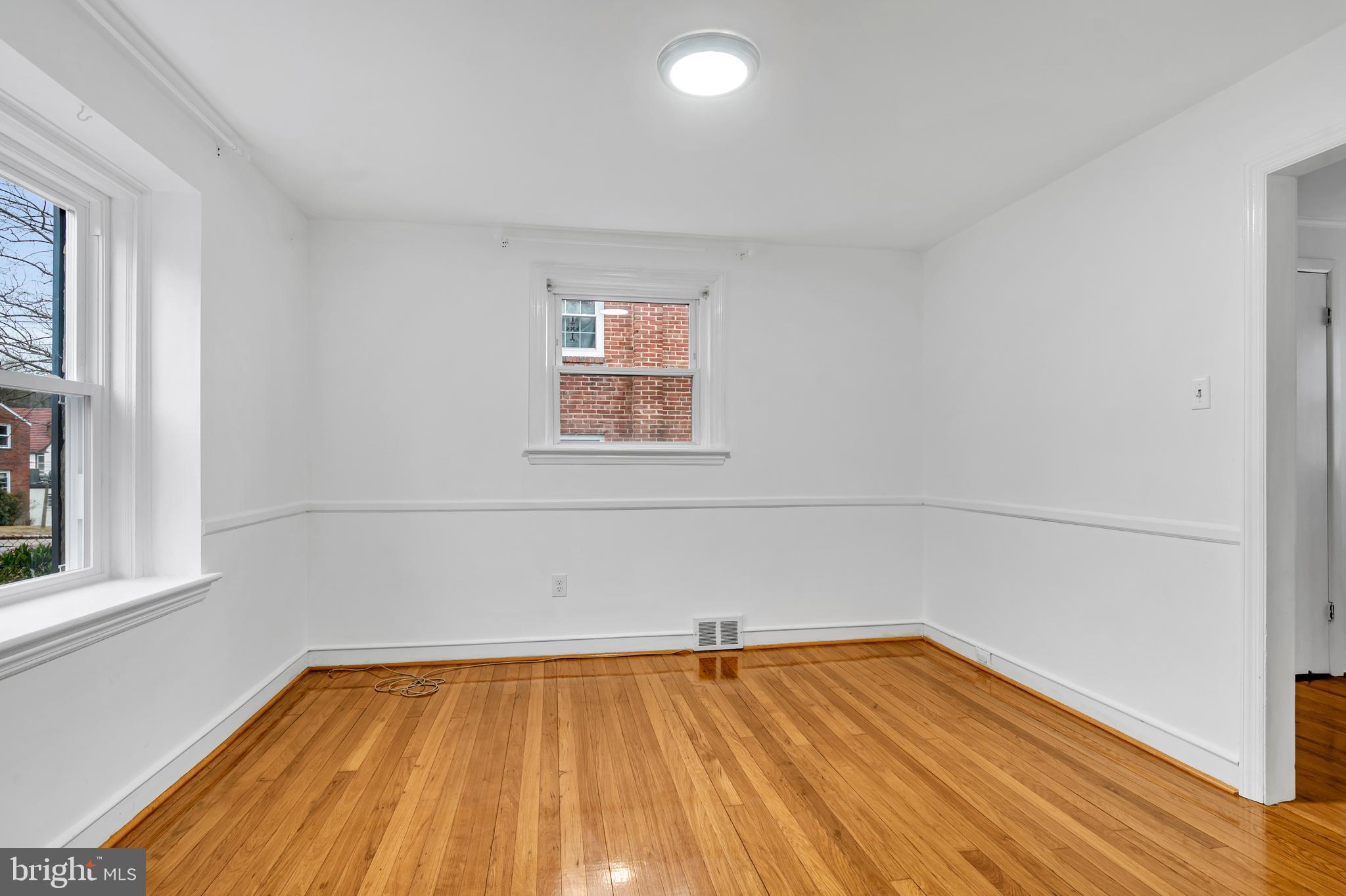 29 School Lane Springfield, PA 19064 - Photo 5 of 29 a view of a room with wooden floor and small window
