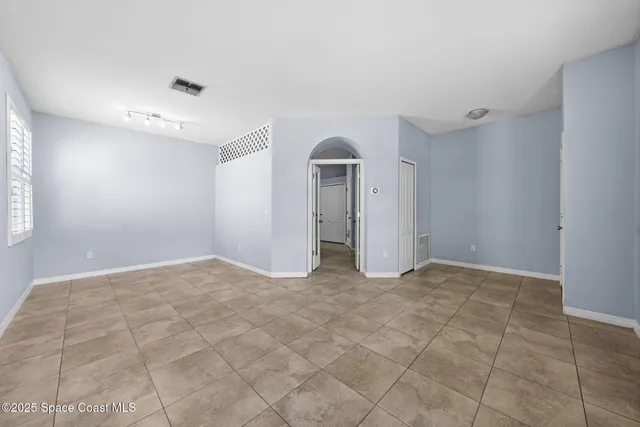 a kitchen with kitchen island a sink counter top space appliances and cabinets