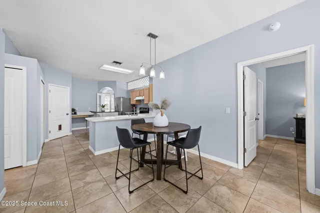 a bedroom with a bed potted plant with the outer view