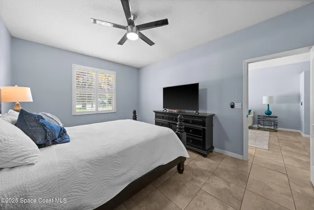 a bedroom with a bed and a table in it