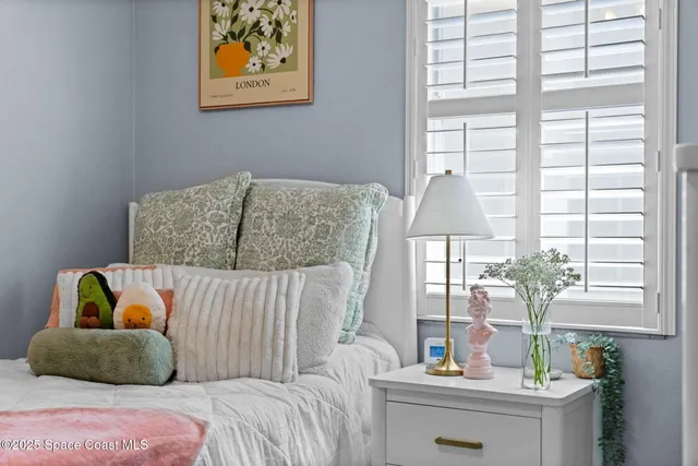 an aerial view of a house with a swimming pool