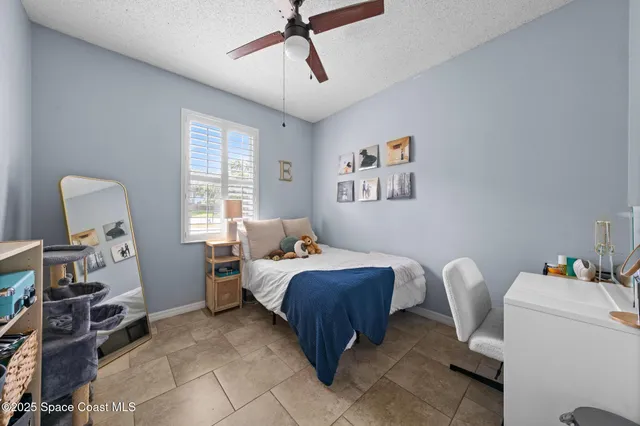 an aerial view of a house with a swimming pool outdoor seating and yard