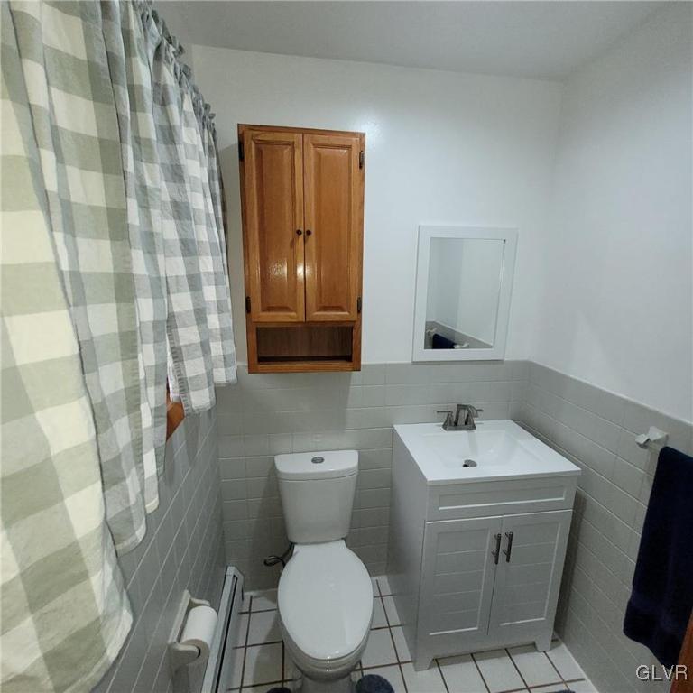 684 Williams Road Nazareth, PA 18064 - Photo 18 of 28 a white toilet sitting next to a bathroom sink