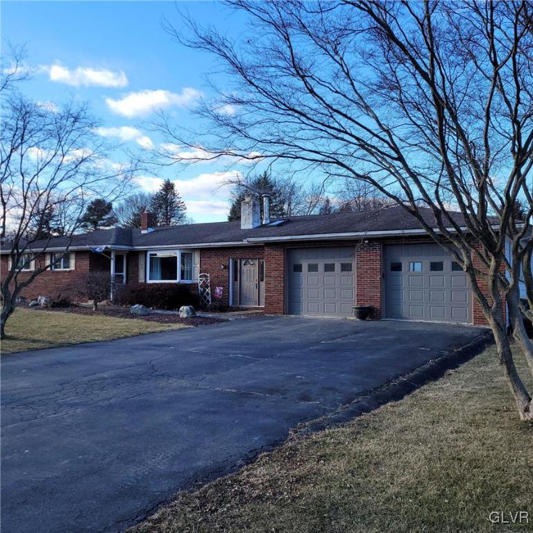 684 Williams Road Nazareth, PA 18064 - Photo 2 of 28 a front view of a house with a garden