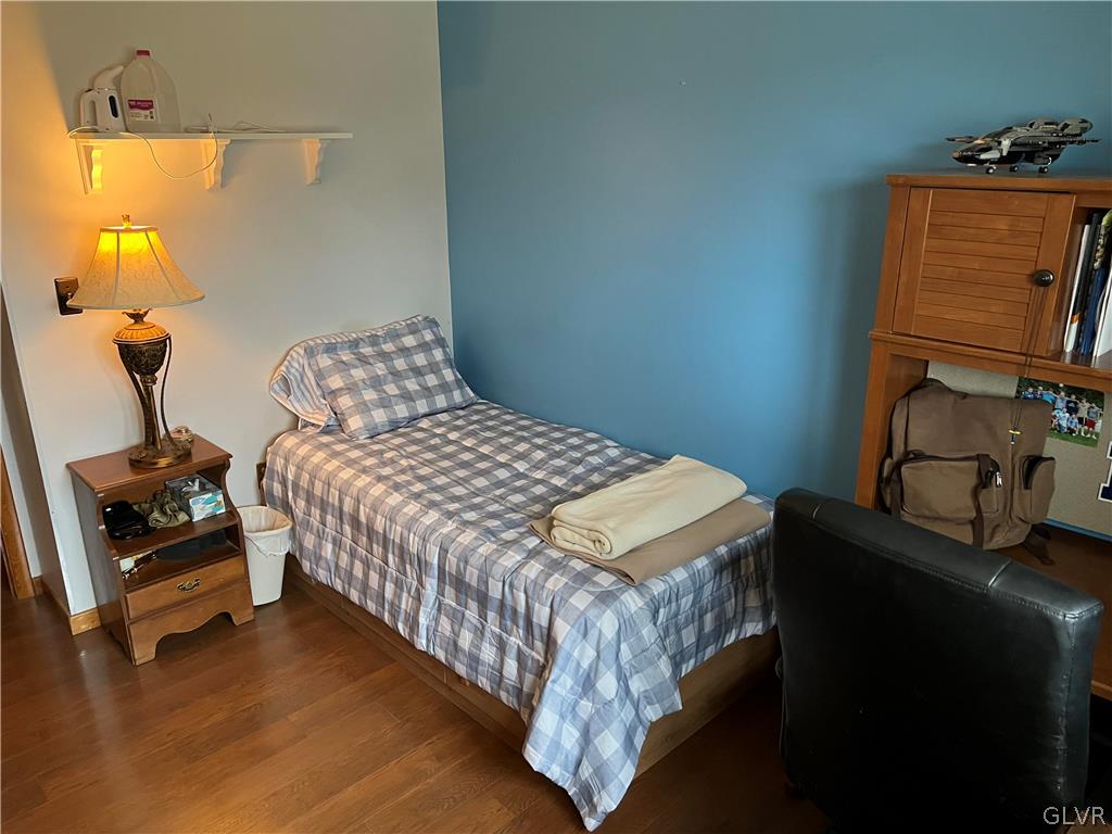 684 Williams Road Nazareth, PA 18064 - Photo 24 of 28 a bedroom with a bed and a lamp on the dresser