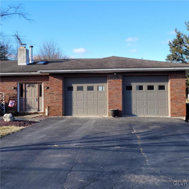 684 Williams Road Nazareth, PA 18064 - Photo 3 of 28 a front view of a house with a garage