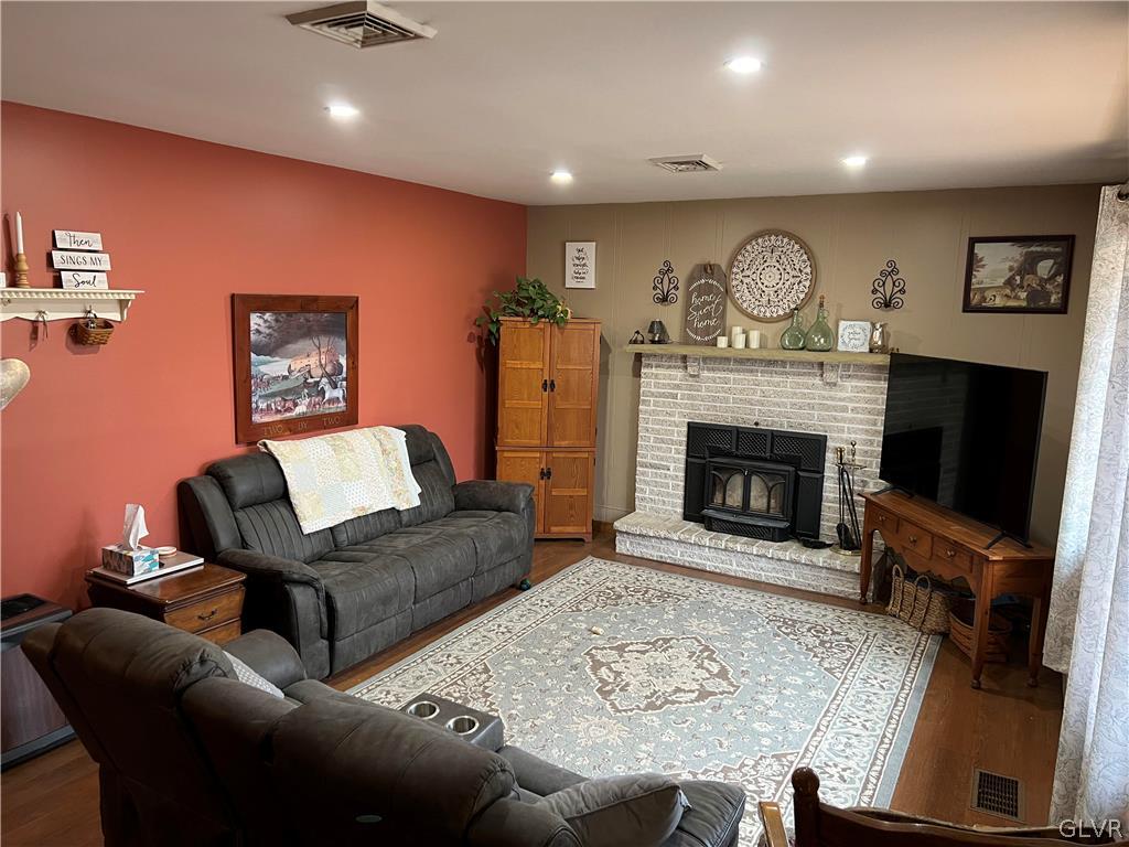 684 Williams Road Nazareth, PA 18064 - Photo 8 of 28 a living room with furniture a flat screen tv and a fireplace
