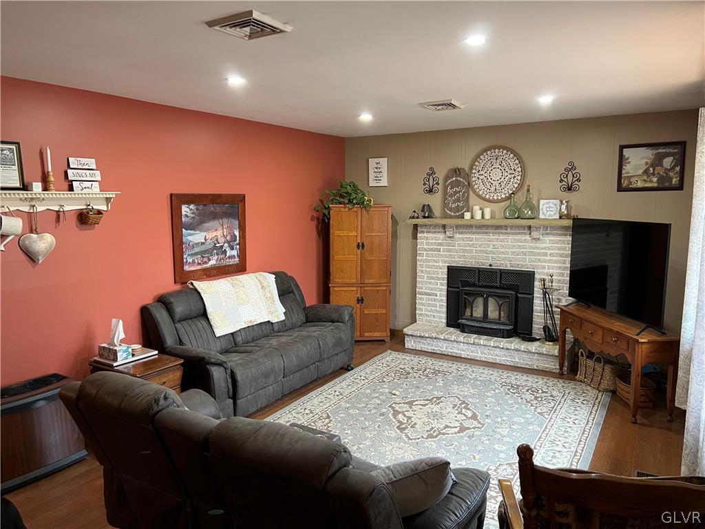 684 Williams Road Nazareth, PA 18064 - Photo 9 of 28 a living room with furniture a flat screen tv and a fireplace