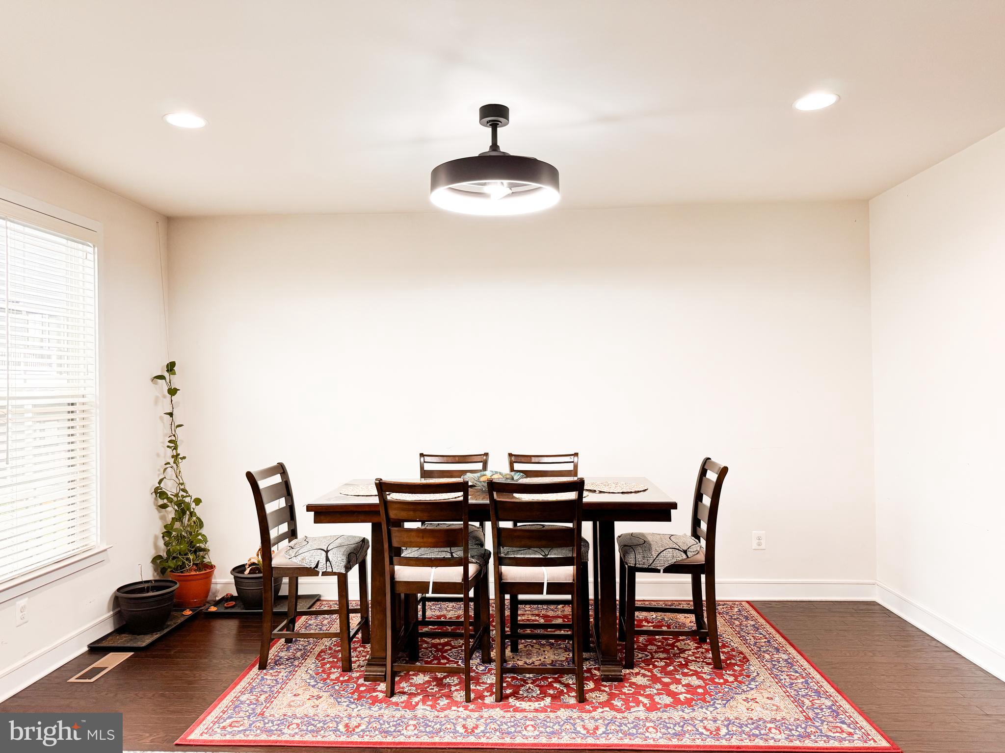 25419 Reed Orchard Terrace Chantilly, VA 20152 - Photo 21 of 47 a view of a dining room with furniture and wooden floor