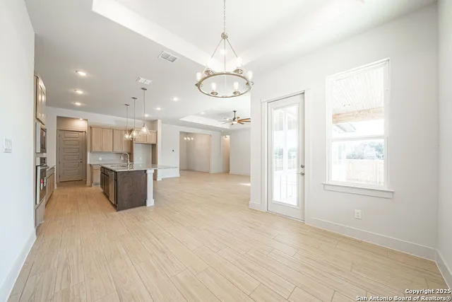 a view of a kitchen with a sink and cabinets