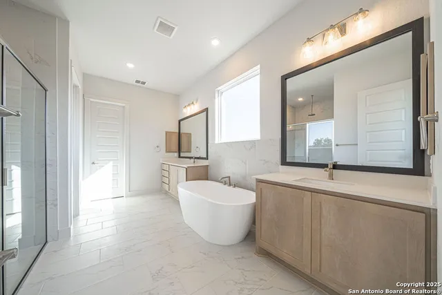 a bathroom with a sink and mirror