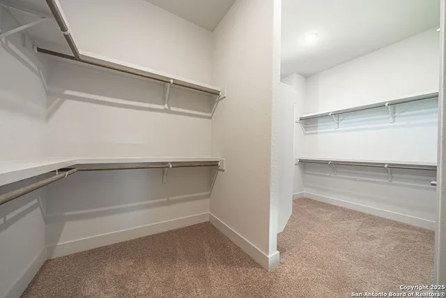 a view of an empty walk in closet