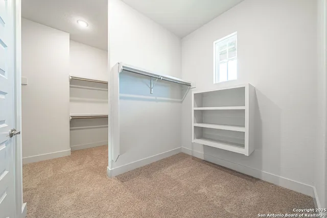 a view of an empty room and a windows