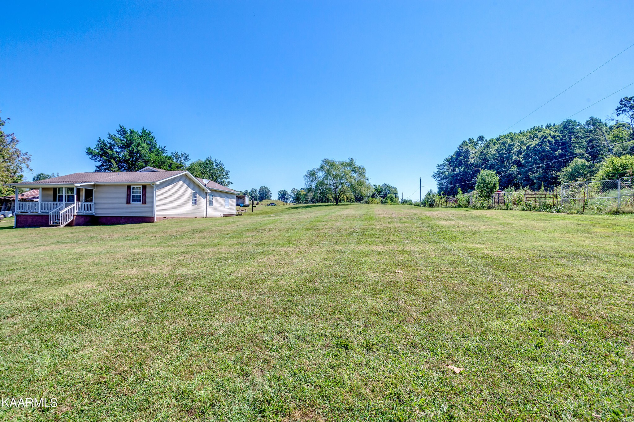 788 Seed Tick Road Philadelphia, TN 37846 - Photo 3 of 14 a view of a house with a big yard