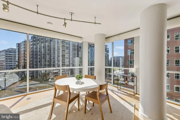 a view of a dining room with furniture window and outside view
