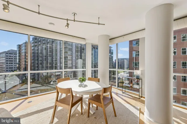a view of a dining room with furniture window and outside view