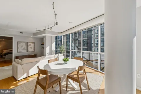 a view of a dining room with furniture window and outside view