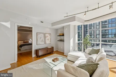 a living room with furniture and a table