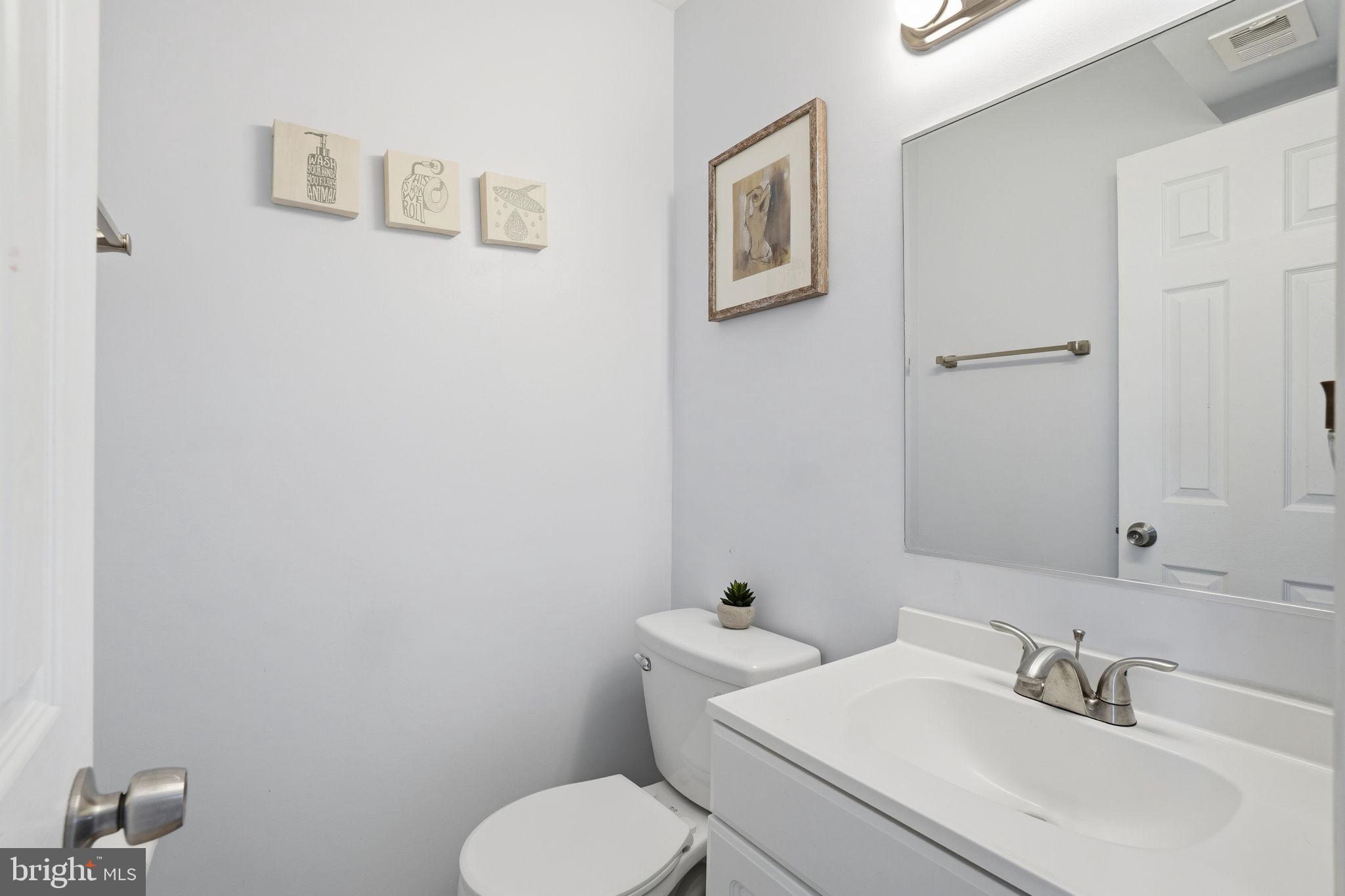 9175 Broken Oak Place, Unit 39B Burke, VA 22015 - Photo 26 of 35 a bathroom with a toilet sink and mirror